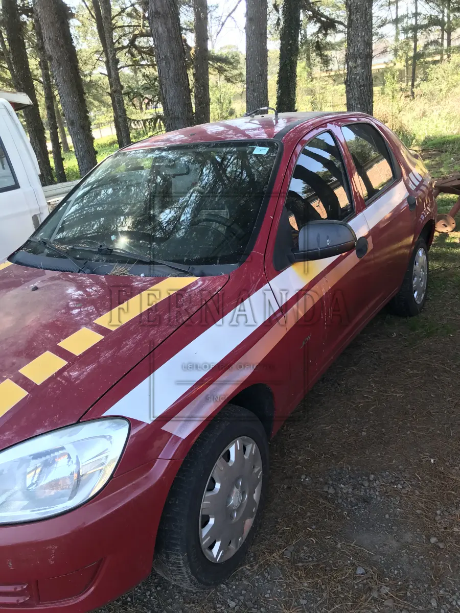 LOTE 003 - GM Prisma Joy 5p, cor vermelho, ano 2009, placa IPV3310.