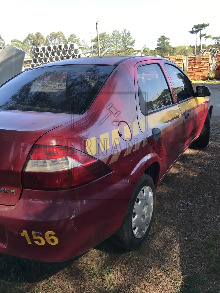 LOTE 004 - GM Prisma Joy 5p, cor vermelha, ano 2009, placa IPW 2635.