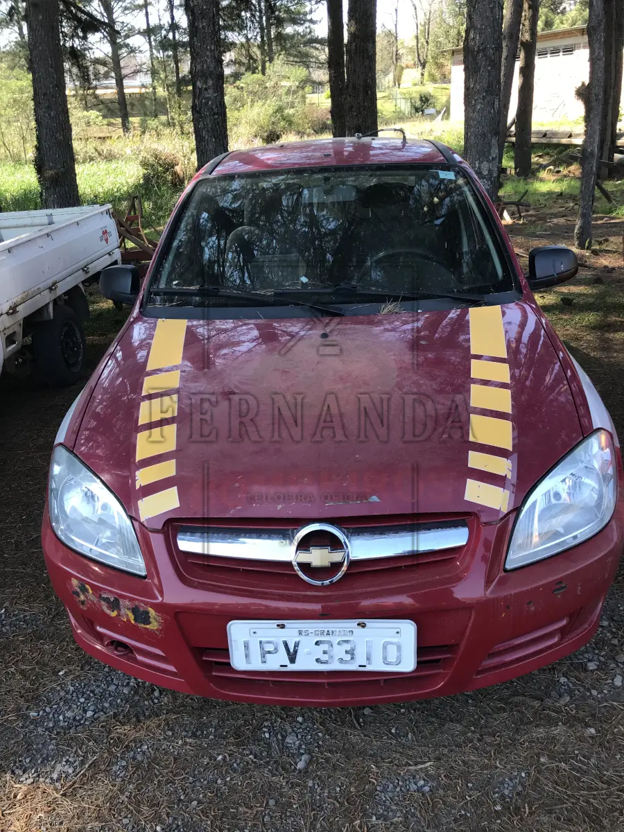 LOTE 003 - GM Prisma Joy 5p, cor vermelho, ano 2009, placa IPV3310.