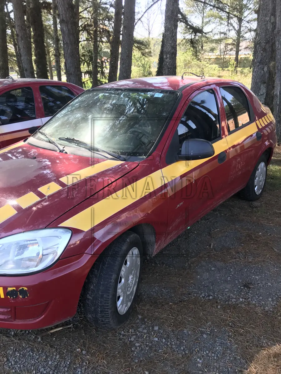LOTE 004 - GM Prisma Joy 5p, cor vermelha, ano 2009, placa IPW 2635.